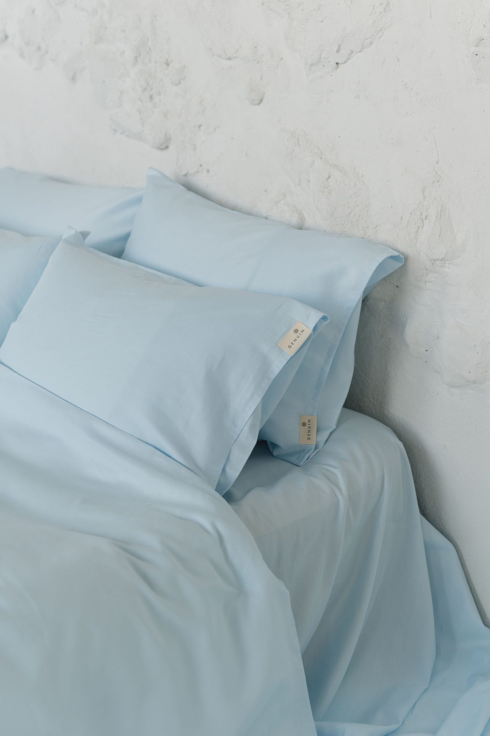 Vandblå satinpudebetræk i bomuld